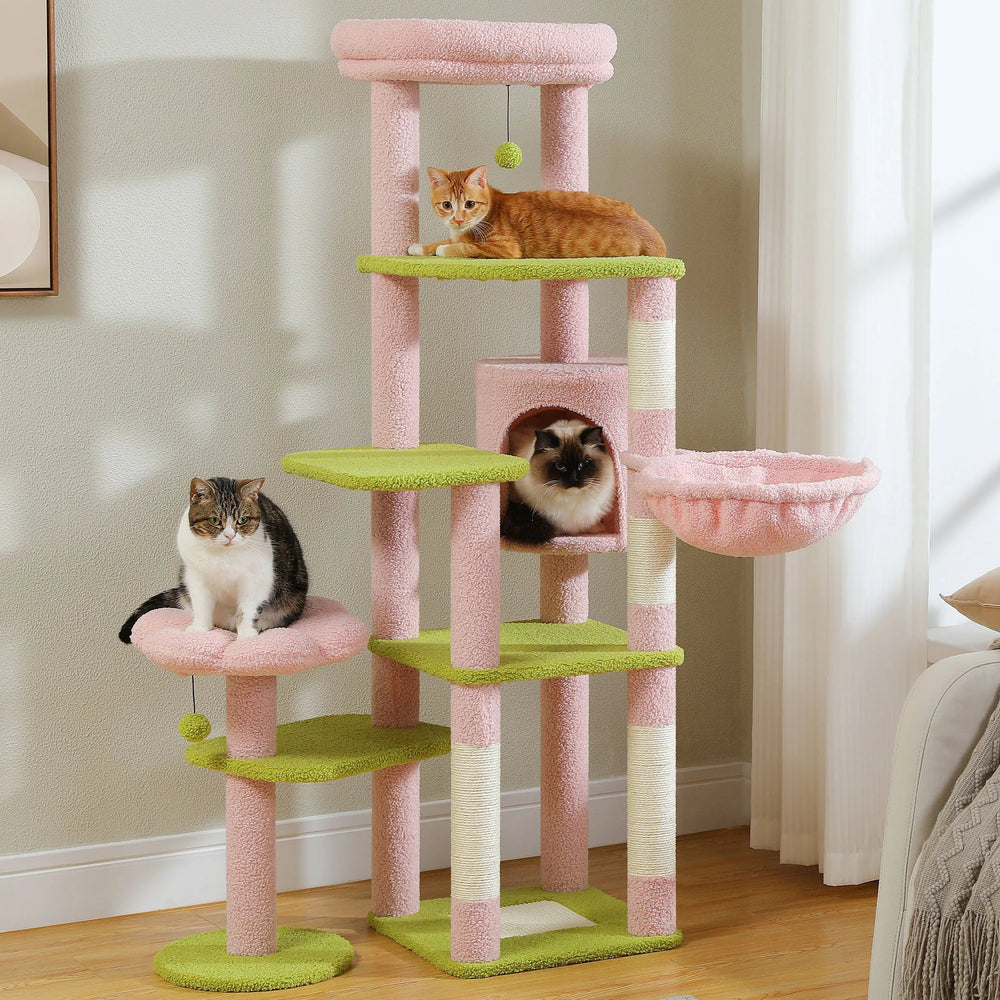 Cat tree with multiple levels and a cat sitting on one of the platforms in a room.